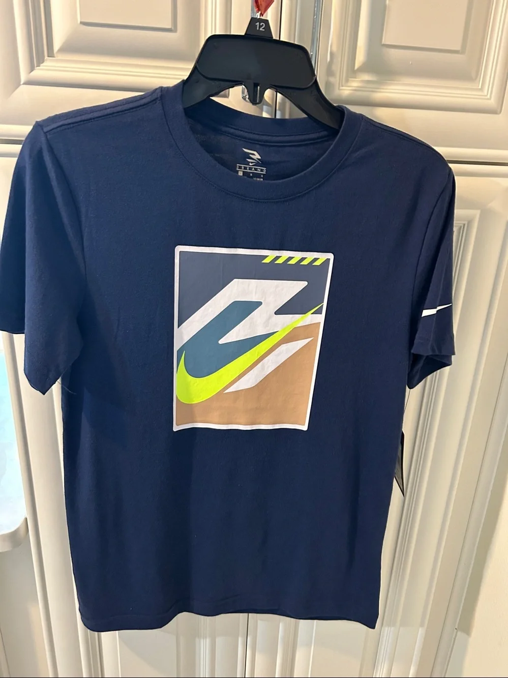 Nike boysNavy Blue Graphic Swoosh T-Shirt with Neon Accent